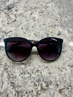 Gucci womens sunglasses. Black Frames with Purple Gradient Lenses